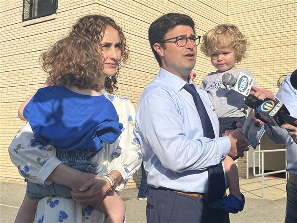 Corey O’Connor talks to the media after he and his wife, Katie, voted at Linden Pre-K in Point Breeze on Tuesday, May 20, 2025. Their children Molly, left, and Emmett, also attended.