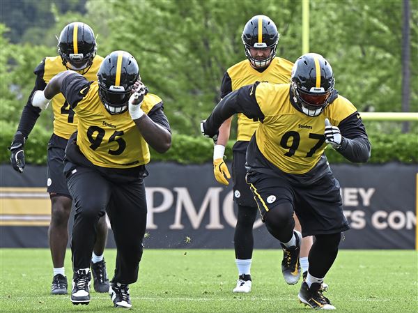 Steelers defensive lineman Keeanu Benton (95) Cam Heyward (97) and Daniel Ekuale  (96) run a sprint at the first day of Steelers Minicamp at the UPMC Rooney Sports Complex on the South Side on Tuesday May 27, 2025. #SteelersA1