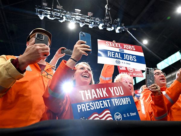 Steelworkers cheer on President Donald Trump as he greets the crowd at a rally at U.S. Steel's Irvin Works in West Mifflin on Friday, May 30, 2025. 