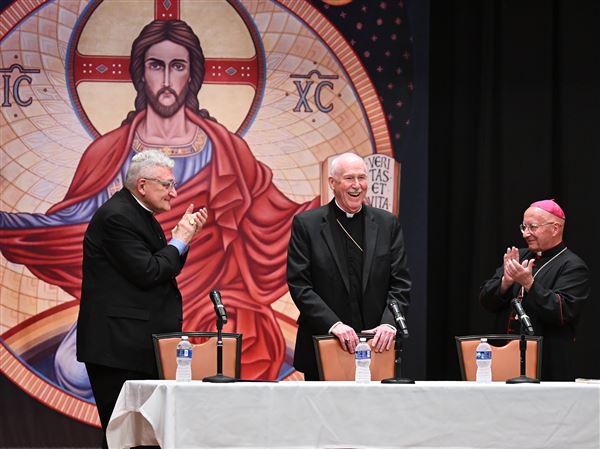 Bishop David A. Zubik led a prayer during a press conference announcing his retirement. Bishop Zubik, who has served the diocese since 2007, will be succeeded by Auxiliary Bishop Mark A. Eckman as the 13th bishop of Pittsburgh. 