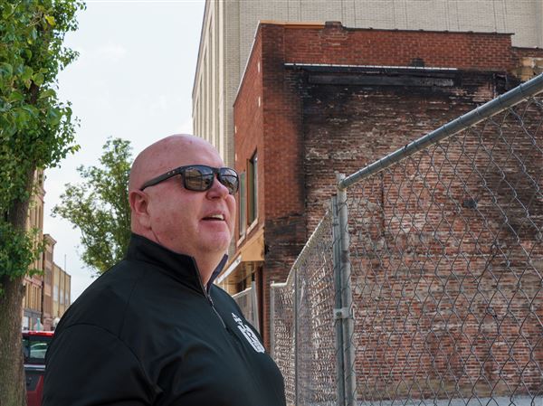 Standing where Riley’s Pour House once served as Carnegie’s gathering spot, owner Joe Riley talks future plans on Tuesday, June 10, 2025. The pub was destroyed by fire in November, but Mr. Riley hopes to reopen in time for St. Patrick’s Day 2026.
