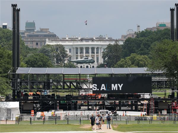 The Sikorsky SH-3 Sea King after dropping of U.S. President Donald Trump at the White House while workers put up temporary fencing ahead of the Army's 250th birthday parade and celebration on June 9, 2025 in Washington.