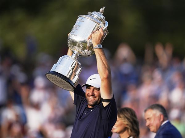 Scottie Scheffler holds the Wanamaker trophy after winning the PGA Championship golf tournament at the Quail Hollow Club on Sunday, May 18, 2025, in Charlotte, N.C.