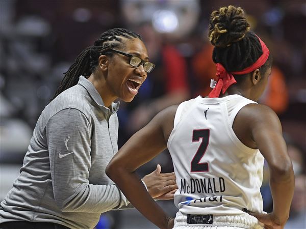 Atlanta Dream head coach Tanisha Wright works during a WNBA