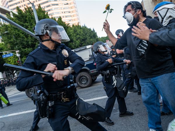 LAPD officers threaten protesters following three days of clashes with police after a series of immigration raids on June 9th in Los Angeles.