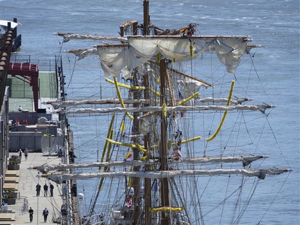 The broken masts of the Cuauhtemoc, a masted Mexican Navy training ship, are seen Monday after it collided with the Brooklyn Bridge in New York on Saturday.