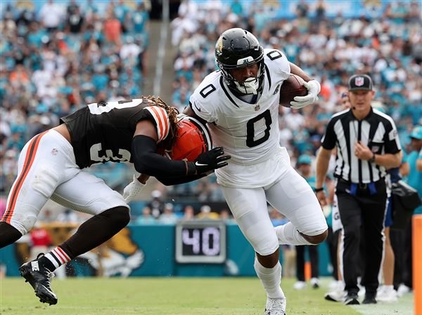 Wide receiver Gabe Davis gets hit by linebacker Khaleke Hudson in the fourth quarter of a Jaguars-Browns game last season Sept. 15, 2024 in Jacksonville.