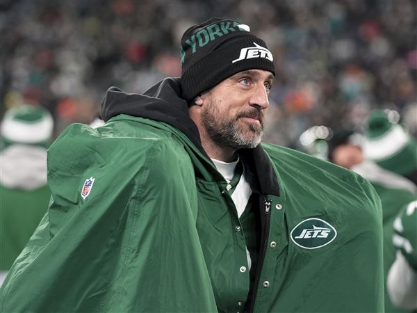 New York Jets quarterback Aaron Rodgers warms up following his 500th career regular-season touchdown pass during the first half of an NFL football game against the Miami Dolphins, Sunday, Jan. 5, 2025, in East Rutherford, N.J. 