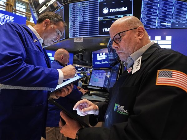 Traders Christopher Lagana, left, and Jeffrey Vazquez work on the floor of the New York Stock Exchange on Wall Street on Thursday, May 29, 2025, in the Financial District neighborhood of New York City’s Manhattan borough.