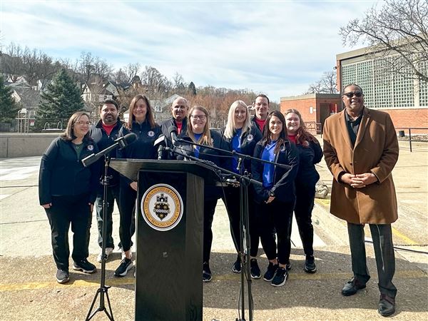 Members of the CitiParks Aquatic Division with Pittsburgh Mayor Ed Gainey at a Wednesday press conference at the Ream Swimming Pool in Mount Washington. CitiParks is launching its lifeguard recruitment efforts for the 2025 outdoor pool season.  
