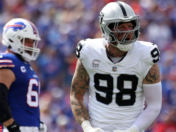 Raiders defensive end Maxx Crosby runs out of sack dances