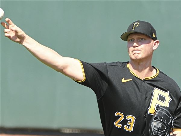 Outfielder Jason Bay of the Pittsburgh Pirates warms up before