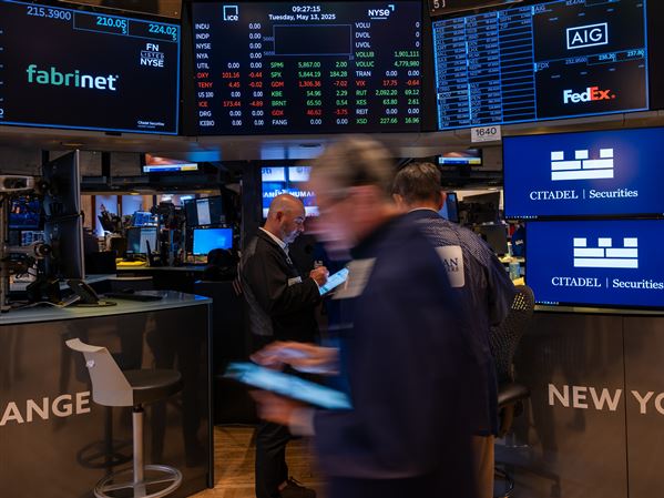 Traders work on the floor of the New York Stock Exchange on Wall Street during morning trading on Tuesday, May 13, 2025, in the Financial District neighborhood of New York City’s Manhattan borough.