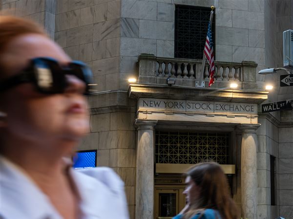 NEW YORK, NEW YORK - MAY 19: People walk along Wall Street by the New York Stock Exchange (NYSE) on May 19, 2025 in New York City. Stocks were down sharply as traders react to Moody's downgrading the United States' credit rating.  (Photo by Spencer Platt/Getty Images)