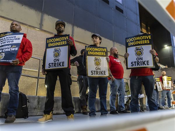 Union members from the Brotherhood of Locomotive Engineers and Trainmen form a picket line Friday outside NJ Transit Headquarters in Newark, N.J.