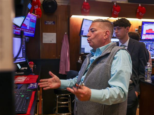 Traders work on the floor of the New York Stock Exchange (NYSE) on Wall Street on Wednesday, May 21, 2025, in the Financial District of New York City’s Manhattan borough.
