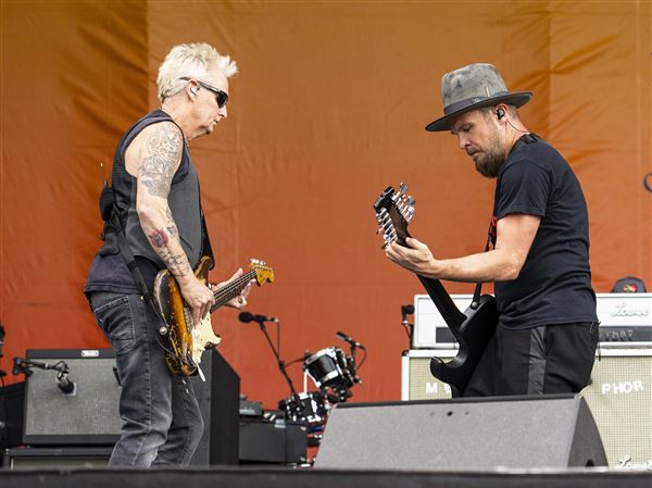 Mike McCready, left, and Jeff Ament of Pearl Jam perform during the second weekend of the New Orleans Jazz & Heritage Festival on Saturday, May 3, 2025, at Fair Grounds Race Course in New Orleans.