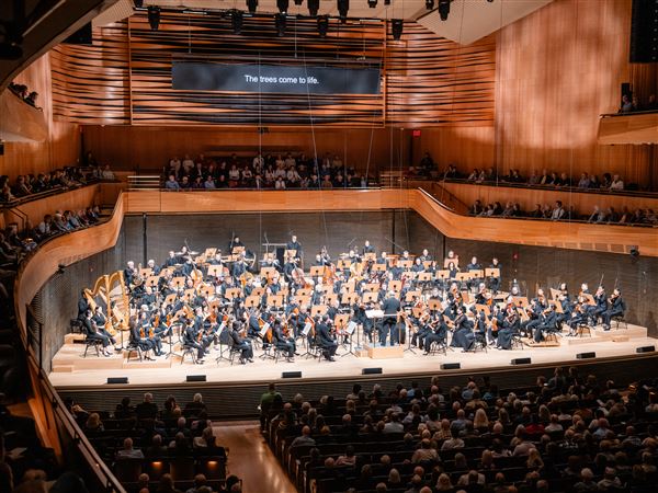 The audience surrounds the stage as Ivan Fischer conducts the New York Philharmonic in David Geffen Hall on April 25.