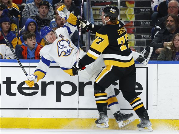 Pittsburgh Penguins center Jeff Carter (77) skates with the puck