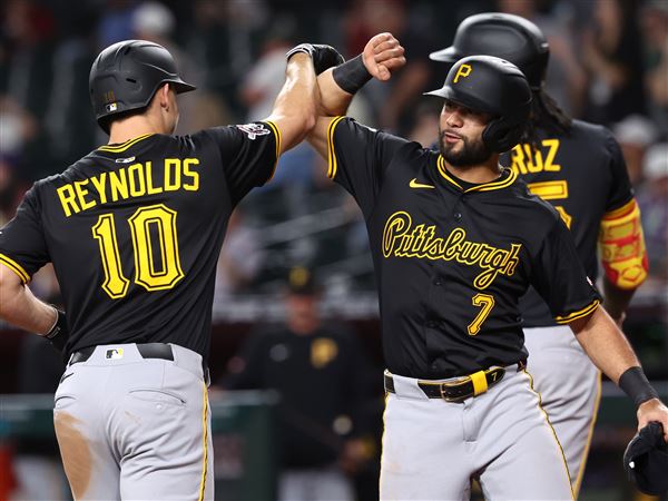 PHOENIX, ARIZONA - MAY 27: Bryan Reynolds #10 celebrates with Isiah Kiner-Falefa #7 of the Pittsburgh Pirates after hitting a three run home run during the eighth inning against the Arizona Diamondbacks at Chase Field on May 27, 2025 in Phoenix, Arizona. (Photo by Chris Coduto/Getty Images)