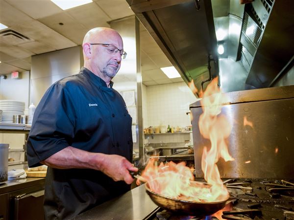 Denny Denk works in the kitchen of of Ruth's Chris Steakhouse in Downtown. 