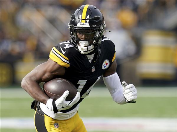 Pittsburgh Steelers wide receiver George Pickens (14) carries during the first half of an NFL football game against the Baltimore Ravens Sunday, Nov. 17, 2024, in Pittsburgh.