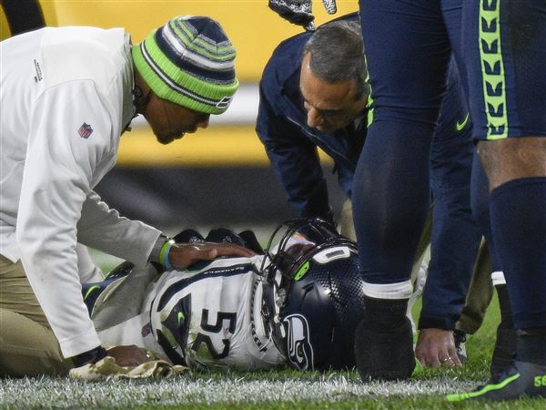 Seattle Seahawks linebacker Darrell Taylor (52) jogs off the field