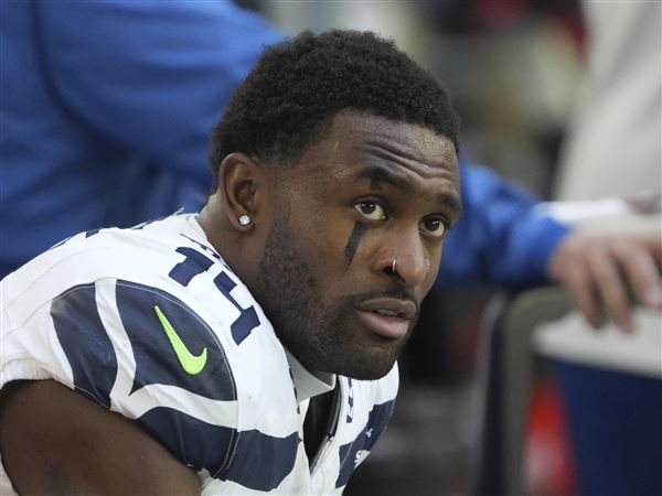 Seattle Seahawks wide receiver DK Metcalf (14) warms up before an NFL football game against the Arizona Cardinals, Sunday, Dec. 8, 2024, in Glendale, Ariz.