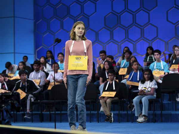 Jane Ross, 14, of Hampton Middle School, spells her word as she competes during the quarterfinals of the Scripps National Spelling Bee at the Gaylord National Resort & Convention Center on Wednesday, May 28, 2025, in Oxon Hill, Md. 