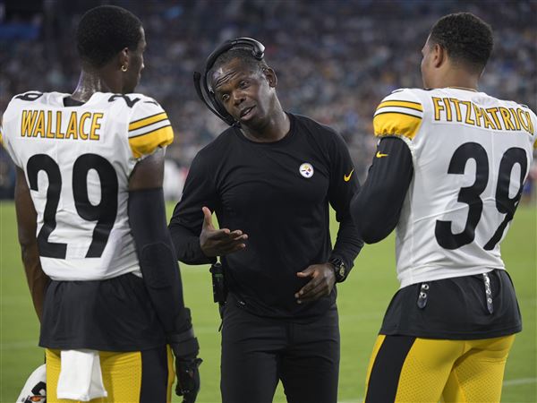 Pittsburgh Steelers head coach Mike Tomlin, center, calls out instructions  from the sideline during the second half of a preseason NFL football game  against the Jacksonville Jaguars, Saturday, Aug. 20, 2022, in