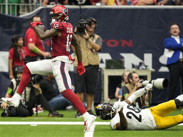 January 9, 2022: Houston Texans wide receiver Nico Collins (12) carries the  ball after a catch during an NFL game between the Texans and the Titans on  Jan. 9, 2022 in Houston