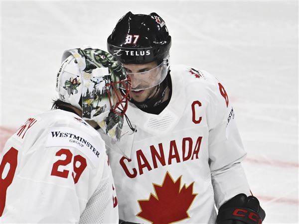Canada's Sidney Crosby and Marc-Andre Fleury celebrating after winning the IIHF Ice Hockey World Championship group A match between Latvia and Canada at Avicii Arena in Stockholm, Sweden, Sunday, May 11, 2025. 