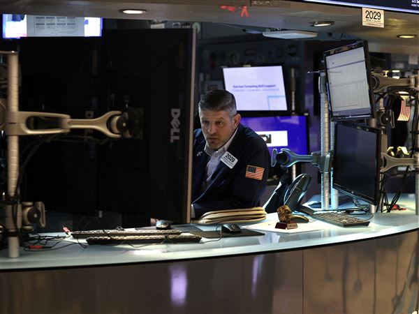A trader works on the floor of the New York Stock Exchange (NYSE) on Wall Street at the opening bell Monday, May 19, 2025, in the Financial District neighborhood of New York City’s Manhattan borough.