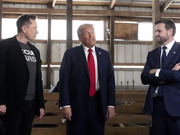 Tesla and SpaceX CEO Elon Musk, from left, Republican presidential nominee former President Donald Trump and Republican vice presidential nominee Sen. JD Vance, R-Ohio, attend a campaign event Oct. 5 in Butler. After the relationship between Trump and Mr. Musk exploded into warfare Thursday, Trump suggested that he might eliminate the tech titan's federal contracts.