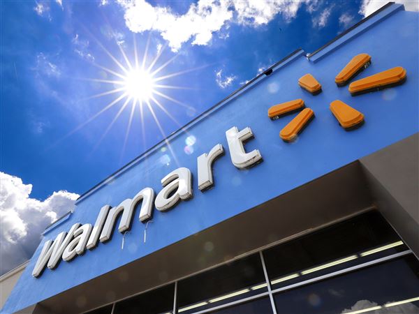 A Walmart sign is displayed over the entrance to a store, June 25, 2019, in Pittsburgh.