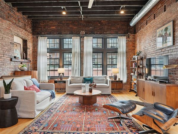 Large windows illuminate the living room of 847 W. North Ave., North Side.