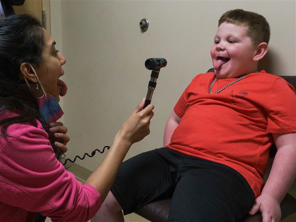 Dr. Sabah Sawari gently examines Derek Workman during an appointment on Friday, April 25, 2025 at WVU Medicine Children’s Uniontown Pediatrics