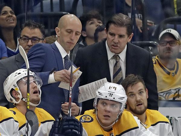 Nashville Predators head coach Peter Laviolette, right, and assistant coach Dan Muse during the third period of an NHL hockey game against the Tampa Bay Lightning Saturday, Oct. 26, 2019, in Tampa, Fla.