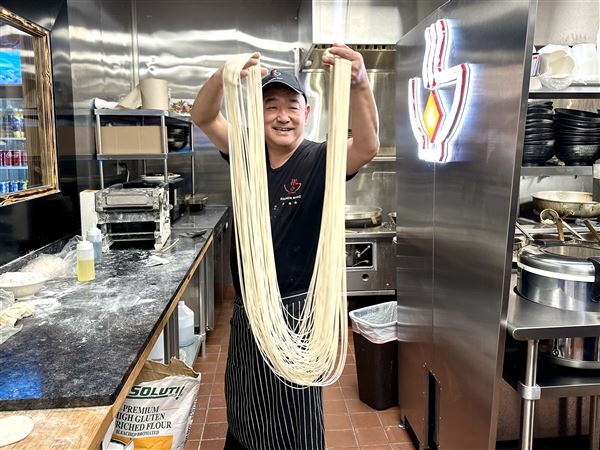Fu Li Zhang displays his hand-pulled noodles at Ramen King 2 in Ross. 