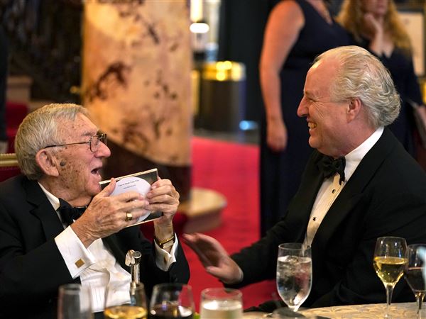 Dick Simmons, left, receives a CD from Pittsburgh Symphony Orchestra music director Manfred Honek at the Opening Night Gala in September 2023. 